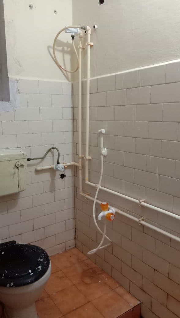 Bathroom pipes and fixtures photographed on the JB business listing